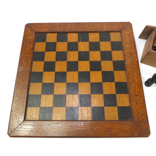 1980A - Three sets of wooden and composite chess pieces and a inlaid oak chess board, 43.5cm x 43.5cm