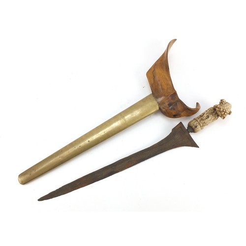 243 - Javanese Kris with carved bone handle and brass sheaf, 50cm in length