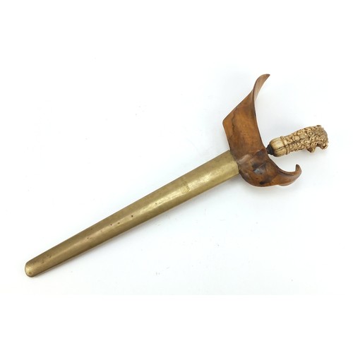 243 - Javanese Kris with carved bone handle and brass sheaf, 50cm in length