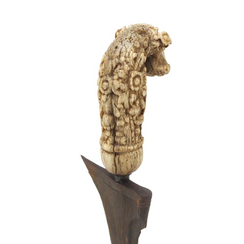 243 - Javanese Kris with carved bone handle and brass sheaf, 50cm in length