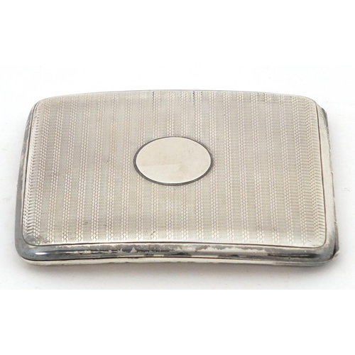 763 - Zachariah Barraclough & Sons, rectangular silver cigarette case, Chester 1914, 10cm wide, 138.2g