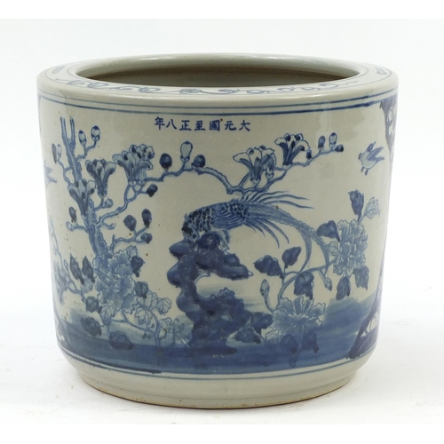 573 - Large Chinese blue and white porcelain jardinière hand painted with birds amongst flowers, six figur... 