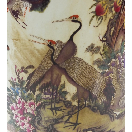 284 - Large Chinese porcelain rouleau vase decorated with cranes in a landscape with peach trees and flowe... 