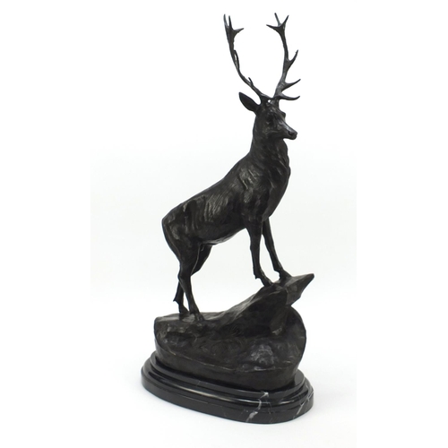 60 - Large patinated bronze stag raised on a stepped marble base, 74cm high