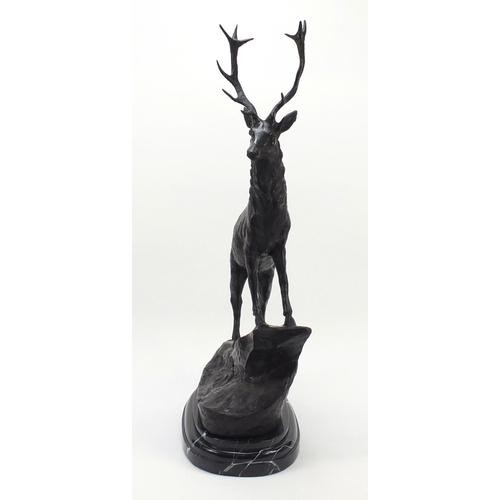 60 - Large patinated bronze stag raised on a stepped marble base, 74cm high