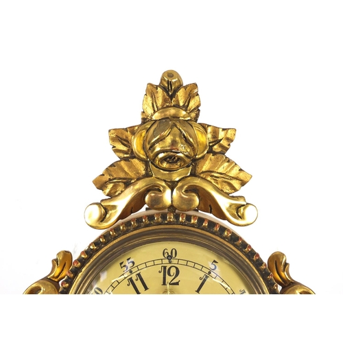 85 - Ornate gilt wood cartel type clock with Arabic numerals, 49cm high