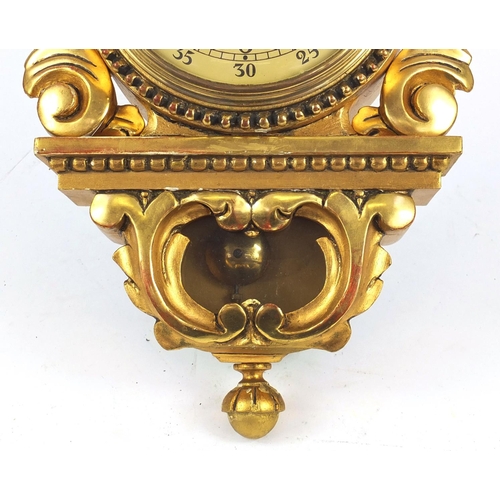 85 - Ornate gilt wood cartel type clock with Arabic numerals, 49cm high