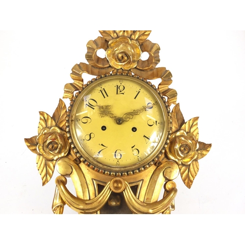 84 - Ornate gilt wood cartel type clock with Arabic numerals, 59cm high