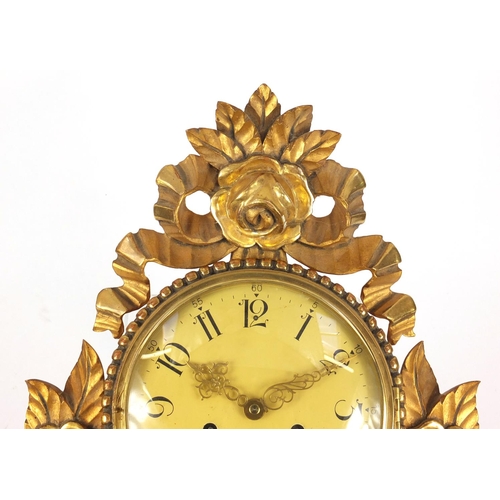 84 - Ornate gilt wood cartel type clock with Arabic numerals, 59cm high