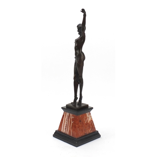 194 - Large patinated bronze figure of a scantily dressed Art Deco female raised on a tapering marble base... 