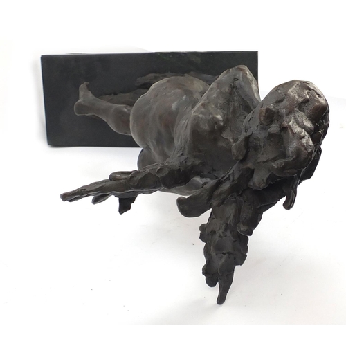 149 - Large surreal patinated bronze of a nude female raised on a green marbleised base, 61cm high