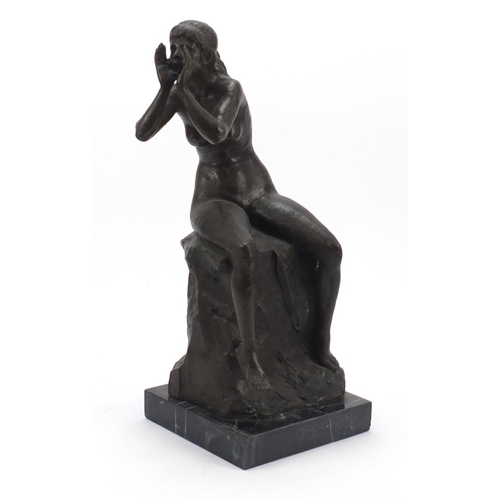 108 - Large patinated bronze figure of a seated nude female raised on a square black marble base, 53cm hig... 