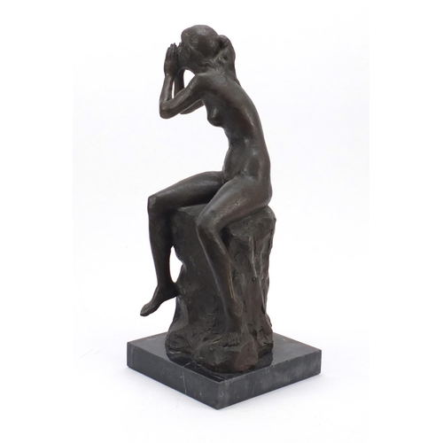 108 - Large patinated bronze figure of a seated nude female raised on a square black marble base, 53cm hig... 