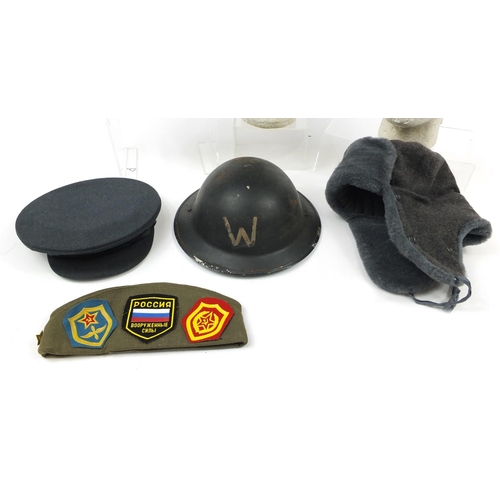 697 - Military interest hats/helmets including RAF, tin Warden and Russian peaked caps