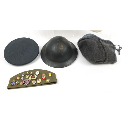 697 - Military interest hats/helmets including RAF, tin Warden and Russian peaked caps