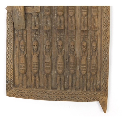 626 - African tribal interest wooden door window carved with figures from Gambia, 71cm x 35cm