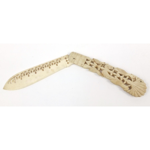 415 - Scrimshaw style bone folding knife, carved with birds in a bush, 20cm in length