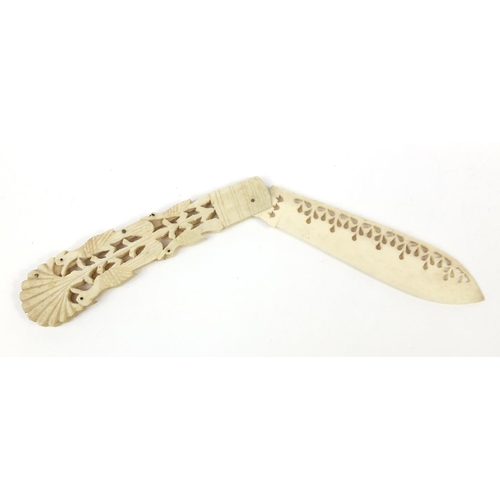 415 - Scrimshaw style bone folding knife, carved with birds in a bush, 20cm in length