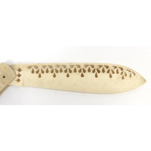 415 - Scrimshaw style bone folding knife, carved with birds in a bush, 20cm in length