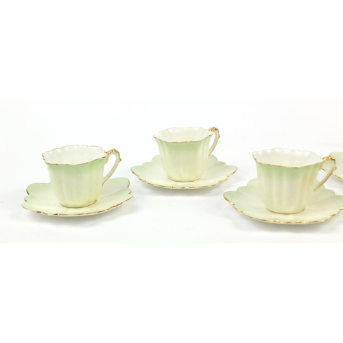 183 - Wileman Foley teaware comprising a teapot and four cups with saucers, the teapot 23cm in length