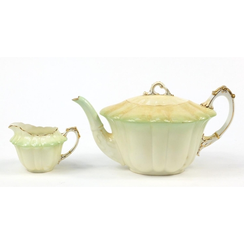 183 - Wileman Foley teaware comprising a teapot and four cups with saucers, the teapot 23cm in length