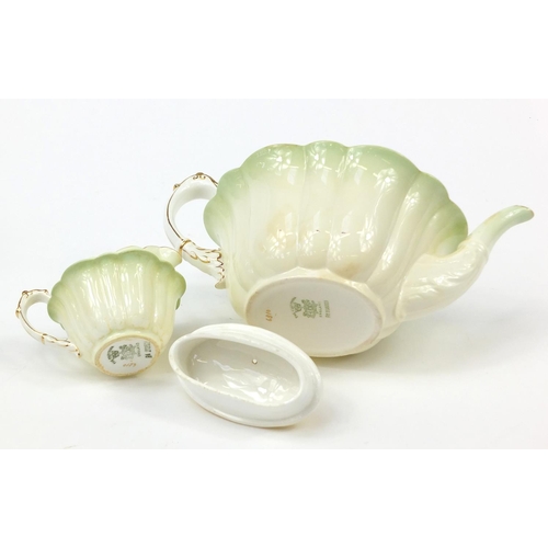 183 - Wileman Foley teaware comprising a teapot and four cups with saucers, the teapot 23cm in length