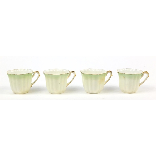 183 - Wileman Foley teaware comprising a teapot and four cups with saucers, the teapot 23cm in length