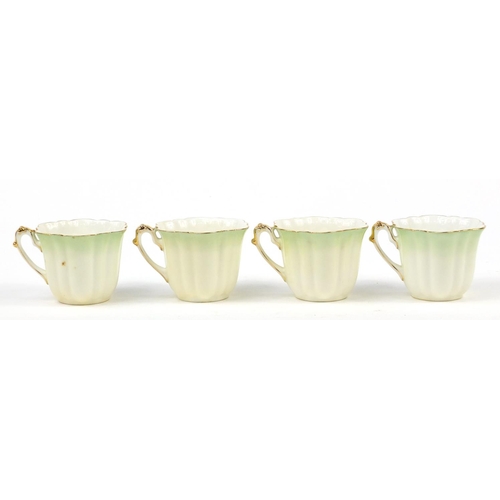 183 - Wileman Foley teaware comprising a teapot and four cups with saucers, the teapot 23cm in length