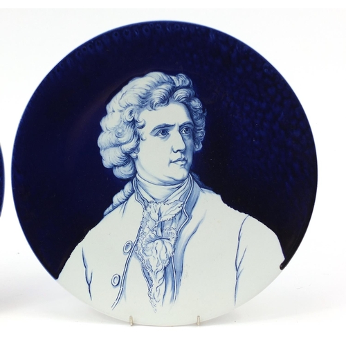 341 - Pair of Villeroy & Boch pottery wall chargers hand painted with Mozart and Goethe, 35cm wide