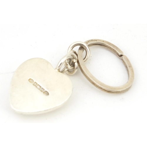 764 - Mappin & Webb, silver heart shaped keyring, Sheffield 2004, 8cm in length, 52.9g