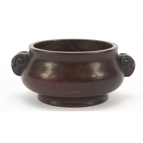 226 - Chinese patinated bronze censer with ram's head handles, four figure character marks to the base, 11... 