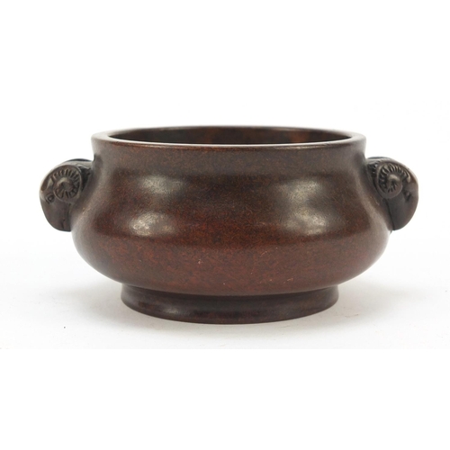 226 - Chinese patinated bronze censer with ram's head handles, four figure character marks to the base, 11... 