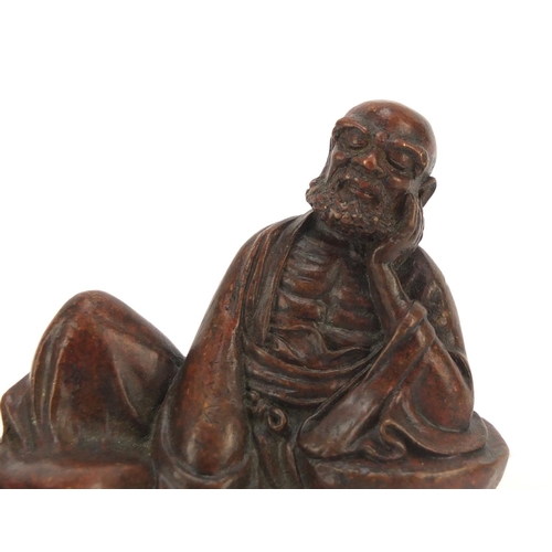 444 - Japanese patinated bronze figure of an immortal, character marks to the base, 8.2cm wide