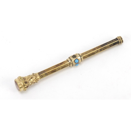 377 - Unmarked gold propelling pencil set with turquoise, (tests as 9ct gold) 6.2cm in length when closed