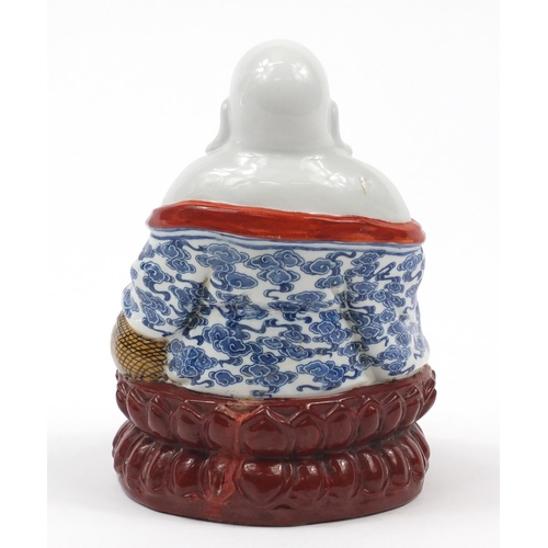 2015 - Chinese porcelain figure of seated Buddha, impressed character marks to the base, 21cm high