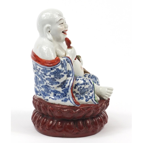 2015 - Chinese porcelain figure of seated Buddha, impressed character marks to the base, 21cm high