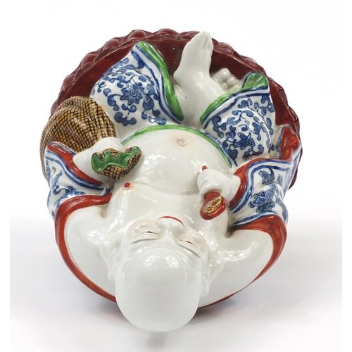 2015 - Chinese porcelain figure of seated Buddha, impressed character marks to the base, 21cm high