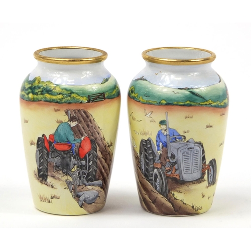 188 - Pair of Moorcroft enamel vases decorated with tractors, each limited edition 27/75, each 7cm high