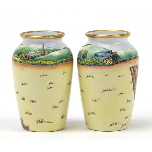 188 - Pair of Moorcroft enamel vases decorated with tractors, each limited edition 27/75, each 7cm high