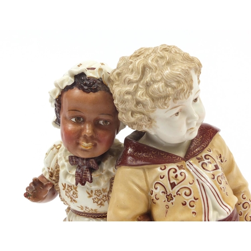 742 - Continental porcelain figure group of two children hand painted with flowers, factory marks PF to th... 