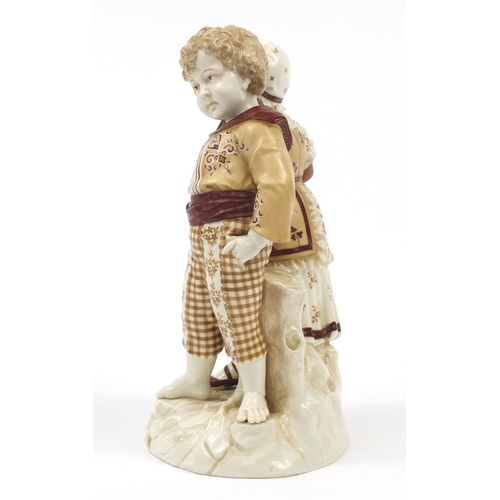 742 - Continental porcelain figure group of two children hand painted with flowers, factory marks PF to th... 