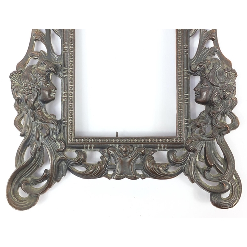 99 - Art Nouveau bronze photo frame embossed with maidenheads, 36cm high