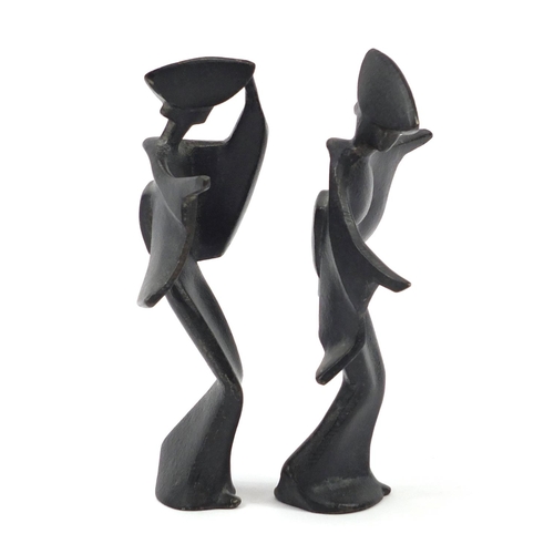 96 - Pair of Japanese Modernist iron figures, the largest 18cm high