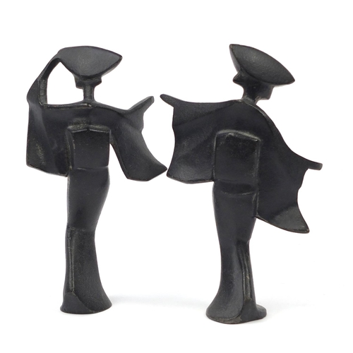 96 - Pair of Japanese Modernist iron figures, the largest 18cm high