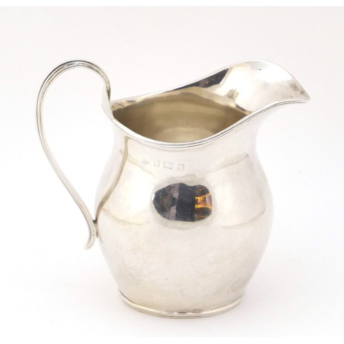 135 - William Aitken, Edwardian silver cream jug, Birmingham 1902, 10cm high, 165g