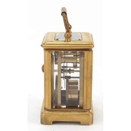 409 - Miniature gilt brass cased carriage clock with Roman and Arabic numerals, 6cm high