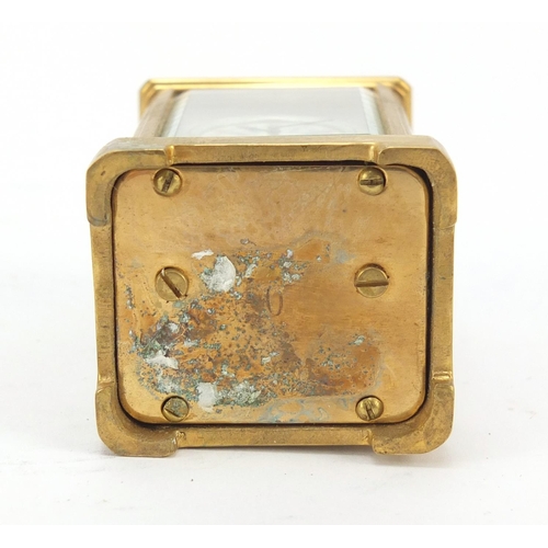 409 - Miniature gilt brass cased carriage clock with Roman and Arabic numerals, 6cm high