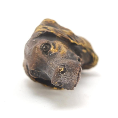 413 - Novelty brass vesta in the form of a dog's head, 5cm high