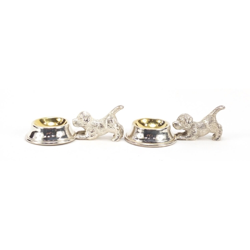 315 - Two novelty silver plated dog design salts with gilt interiors, each 10cm wide