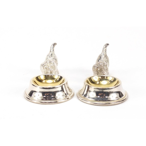 315 - Two novelty silver plated dog design salts with gilt interiors, each 10cm wide